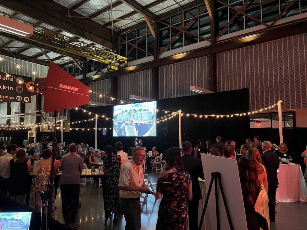 16 ft Fastfold Screen with Black Velour drape and Market Lights